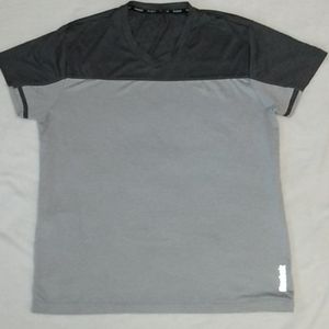 Reebok Men's running short sleeve with pocket reflective shirt like new large